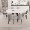47-63" expandable circular dining tables , equipped with 6 PU fabric thick cushioned dining chairs and an elegant and spacious dining table