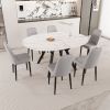 47-63" expandable circular dining tables , equipped with 6 PU fabric thick cushioned dining chairs and an elegant and spacious dining table